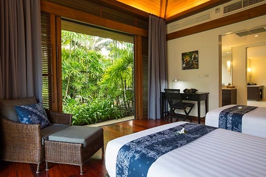 Twin bedroom view to lush tropical garden